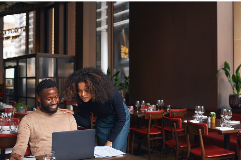 Couple In Front Of A Laptop